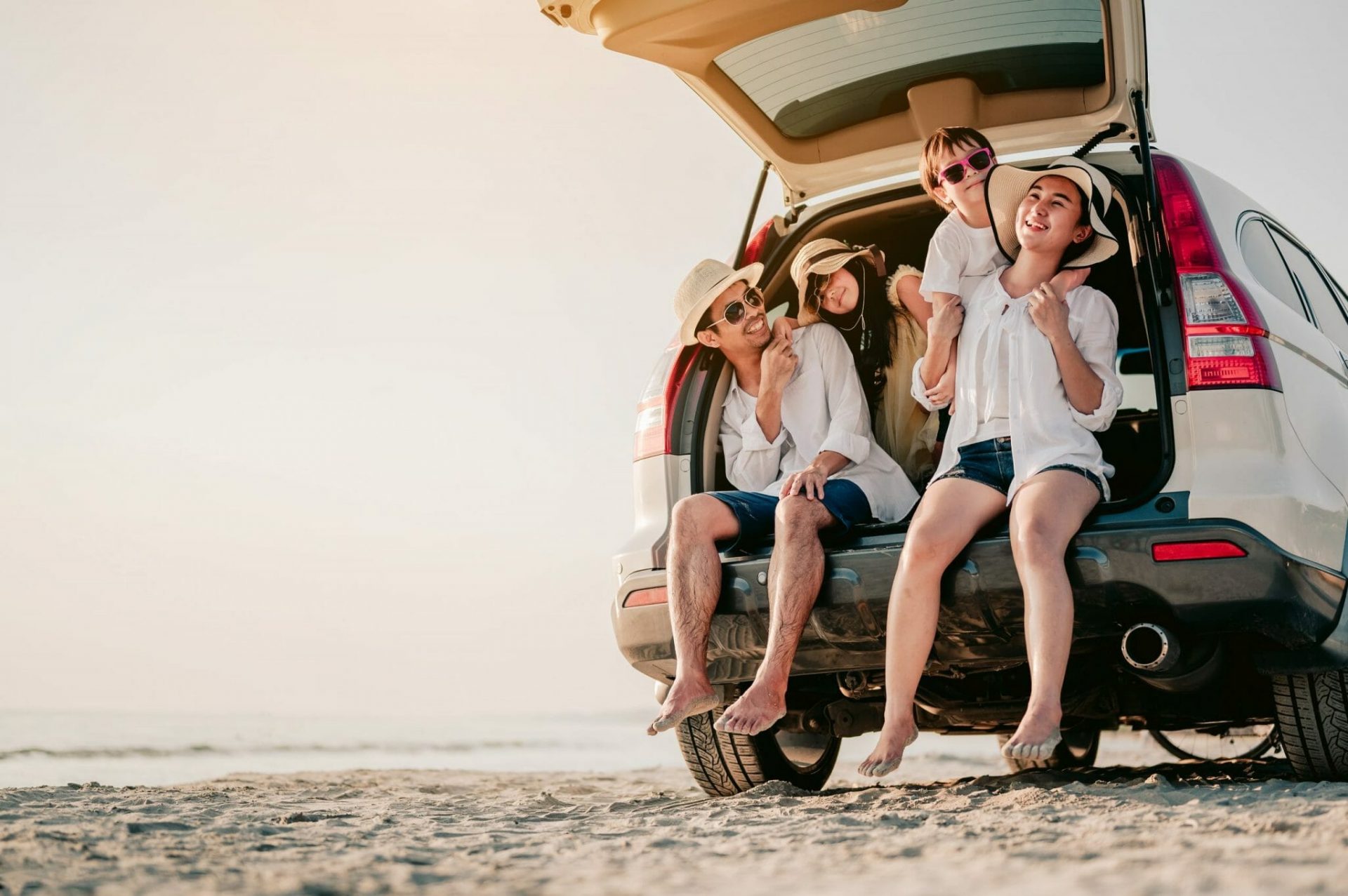 Happy,Family,On,A,Road,Trip,In,Their,Car.,Dad, shutterstock 1912319653 scaled