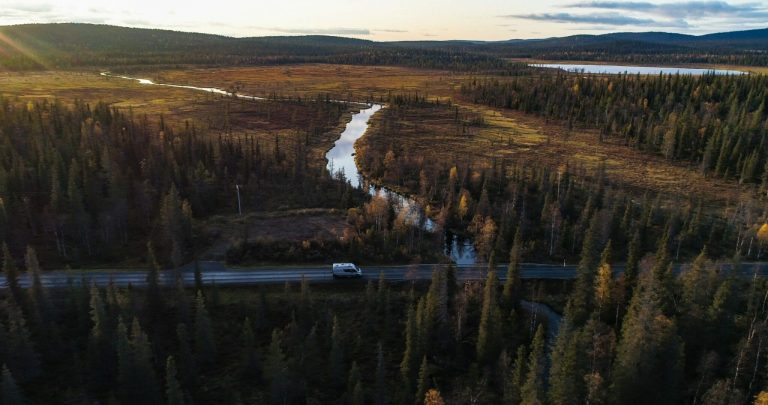 Camper,Van,In,A,Autumn,Forest,In,Lappland,,Aerial,Drone shutterstock 1944513337 scaled